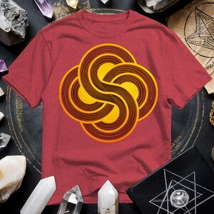 a red t - shirt with a yellow swirl on it