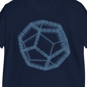 May include: A navy blue t-shirt with a geometric design in a lighter blue color. The design is a 3D rendering of a complex geometric shape.
