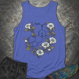 May include: A blue vest top featuring a black chemical structure diagram centred on the chest, surrounded by a wreath of light blue morning glory flowers with green leaves and vines. The chemical formula H2N is clearly visible in the centre.