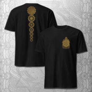 May include: Black t-shirts with gold geometric designs. One shirt features a vertical series of interconnected flower of life patterns on the back. The other shirt has a smaller, similar design on the front. The designs are intricate and detailed.