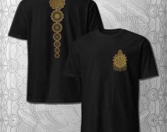 May include: Black t-shirts with gold geometric designs. One shirt features a vertical series of interconnected flower of life patterns on the back. The other shirt has a smaller, similar design on the front. The designs are intricate and detailed.