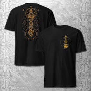 May include: Black t-shirts with gold-colored geometric designs. One shirt features a brain, DNA strand, and heart. The other shirt has a pyramid, brain, and skull. Both shirts have a crew neck and short sleeves.