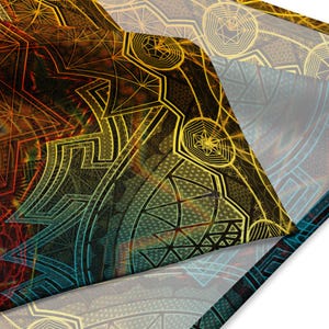 May include: A colourful abstract design with geometric shapes and patterns in shades of yellow, orange, red, blue, and green. The design is layered and folded, creating a sense of depth and dimension.