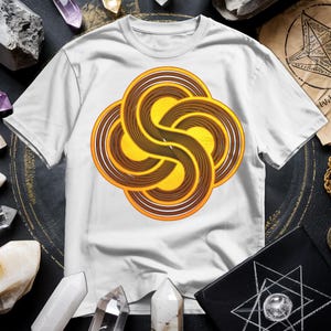 a white t - shirt with a yellow and brown swirl on it