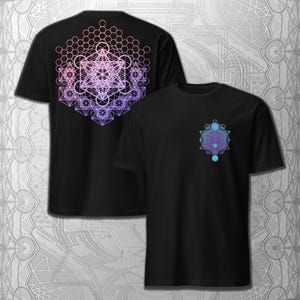 May include: Black t-shirts with geometric designs. One shirt features a large, colorful design on the back, while the other has a smaller design on the front. The designs are in shades of purple, pink, and blue.
