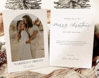 May include: A Christmas card with a photo of a couple in a desert setting. The card reads "Married & Bright" with the couple's name "The Williams" underneath. The card also includes a message wishing a merry Christmas and happy new year, with the names "John and Amanda" at the bottom.