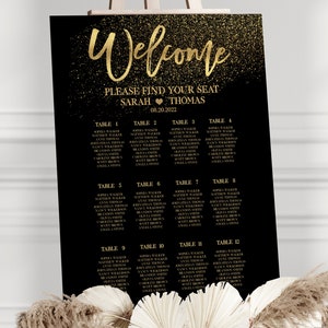 May include: A black and gold wedding seating chart with a glitter background. The chart lists the names of guests and their assigned tables. The text at the top reads "Welcome" and "Please find your seat Sarah & Thomas 08.20.2022".