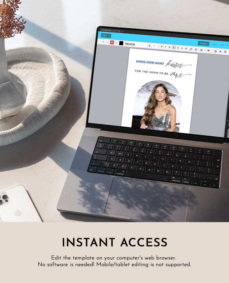 May include: A laptop displays a bridal shower game template. The text on the screen reads "GUESS HOW MANY KISSES FOR THE SOON-TO-BE MRS." Below the screen is the text "INSTANT ACCESS". A white phone and decorative tray are also visible.
