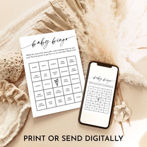 May include: A printable baby bingo card with a black and white design. The card features a grid with squares containing various baby-related items, such as diapers, onesies, and a baby carrier. The text "baby bingo" is written in a cursive font at the top of the card. The text "While the mom-to-be opens gifts, mark matching items on your card. The first person to get five in a row and shout Bingo wins!" is written below the title.