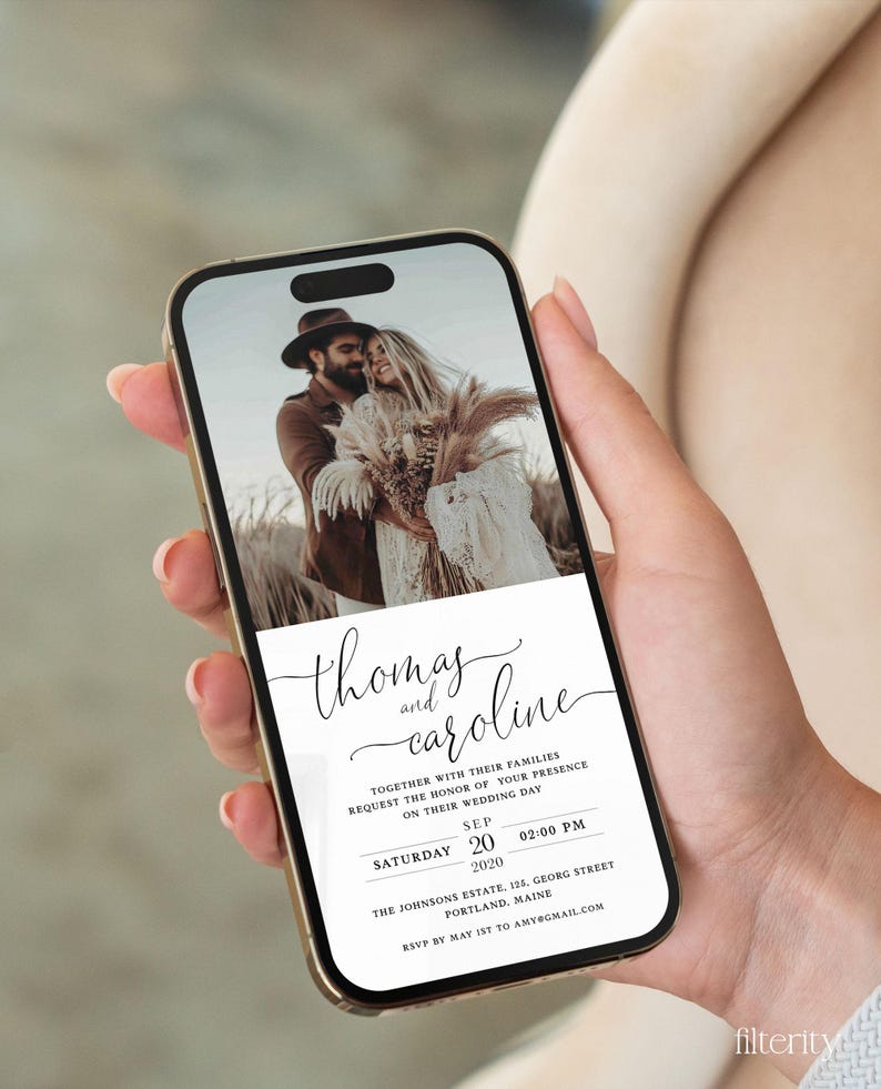 May include: A wedding invitation on a smartphone screen with a photo of a couple in the background. The invitation is for Thomas and Caroline's wedding on September 20, 2020, at 2:00 PM. The location is The Johnsons Estate, 125 Georg Street, Portland, Maine. RSVP by May 1st to amy@gmail.com.
