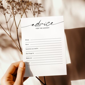 May include: A white card with black text that reads "advice for the mommy". The card has blank lines for writing advice for a new mom.