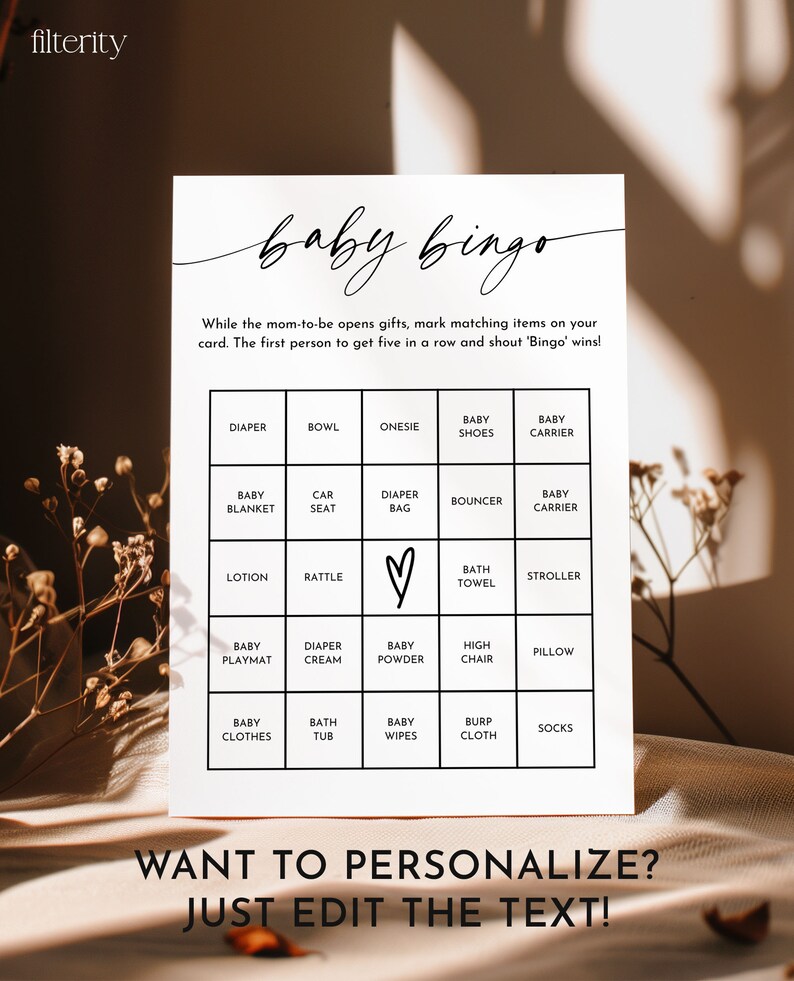 May include: A printable baby bingo card with a black and white design. The card has a 5x5 grid with squares containing baby-related items such as diapers, onesies, and rattles. The text "baby bingo" is written in cursive at the top of the card. The text "Want to personalize? Just edit the text!" is written at the bottom of the card.