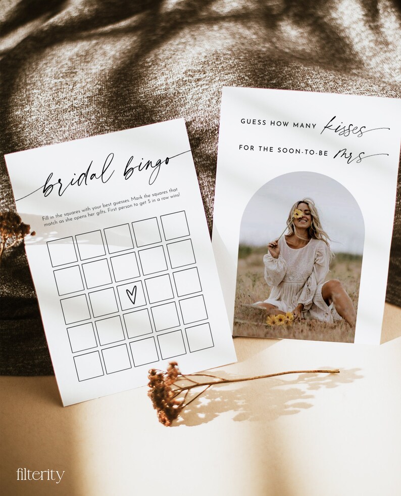 May include: A bridal shower game with a bingo card and a card that says "Guess how many kisses for the soon-to-be Mrs.". The bingo card has a heart in the center square.