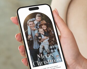 May include: A digital Christmas card with a photo of a family of four. The card reads "Merry Christmas" with the text "With love, The Smith Family John, Amanda, William and Thomas" below the photo.