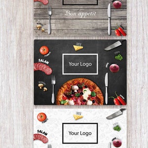 May include: Three different designs for a restaurant placemat. Each placemat features a wooden background with a variety of food items, including salami, tomatoes, onions, and peppers. The text "Your Logo" and "Bon appetit" are printed on the placemats.