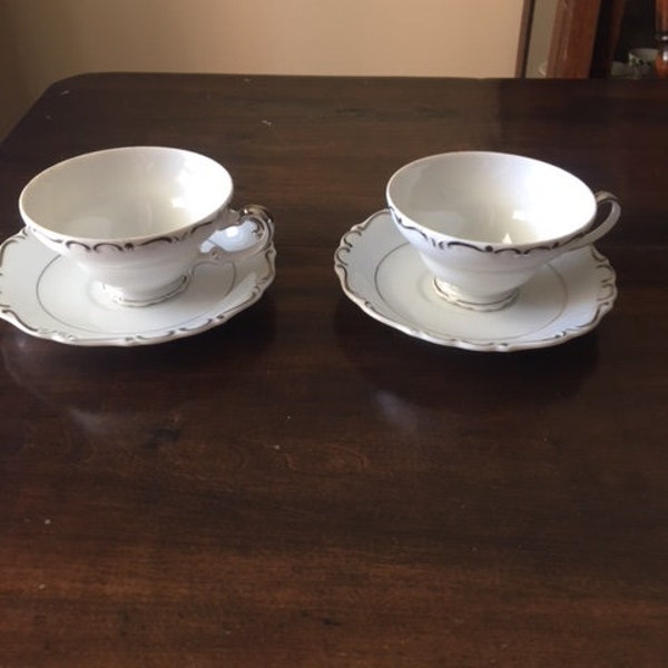 Two Heirloom by Ucagco cups and saucers