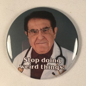 May include: A round button with a photo of a man wearing a white doctor's coat and a stethoscope. The text "Stop doing weird things." is printed on the button.