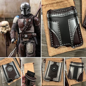 May include: A set of five leather wallets with a Mandalorian design. The wallets are brown, black, and silver with a variety of stitching details. The wallets are displayed on a variety of surfaces, including burlap, wood, and a table.