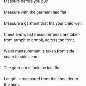 May include: Text on a white background provides instructions for measuring children's clothing. The text includes phrases like "Measure before you buy," "Measure with the garment laid flat," and "Chest and waist measurements are taken from armpit to armpit."