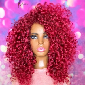 May include: A set of three ceramic mugs with a speckled, cream-colored glaze. Each mug features a different hand-painted floral design in shades of blue, green, and yellow. The mugs have a simple, rounded shape and a comfortable handle.