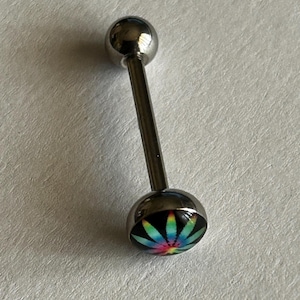May include: A silver-toned barbell body jewelry piece featuring a straight post with a smooth spherical top and a bottom dome-shaped end. The bottom dome displays a vibrant, multi-colored tie-dye leaf graphic set against a solid black background.