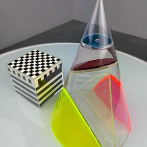 May include: A set of three ceramic mugs with a speckled, matte finish. Each mug is a different colour: light blue, cream, and grey. The mugs have a simple, modern design, ideal for coffee or tea.