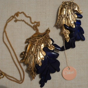Chloé Exclusive Set, late 1970s. Necklace and Brooch in gilded metal and resin