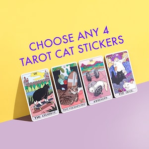 May include: Four colorful tarot card stickers featuring cats in various poses. The cards are labeled "The Chariot", "The Hierophant", "Strength", and "The Devil".