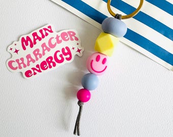 Mixed beads trend Keychain: soft blue, pink with a smiley, bag charm