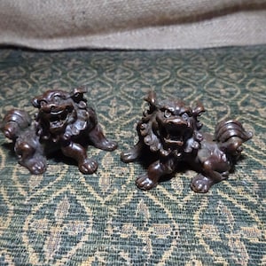 Pair of signed bronze Chinese temple guardian lions / dogs