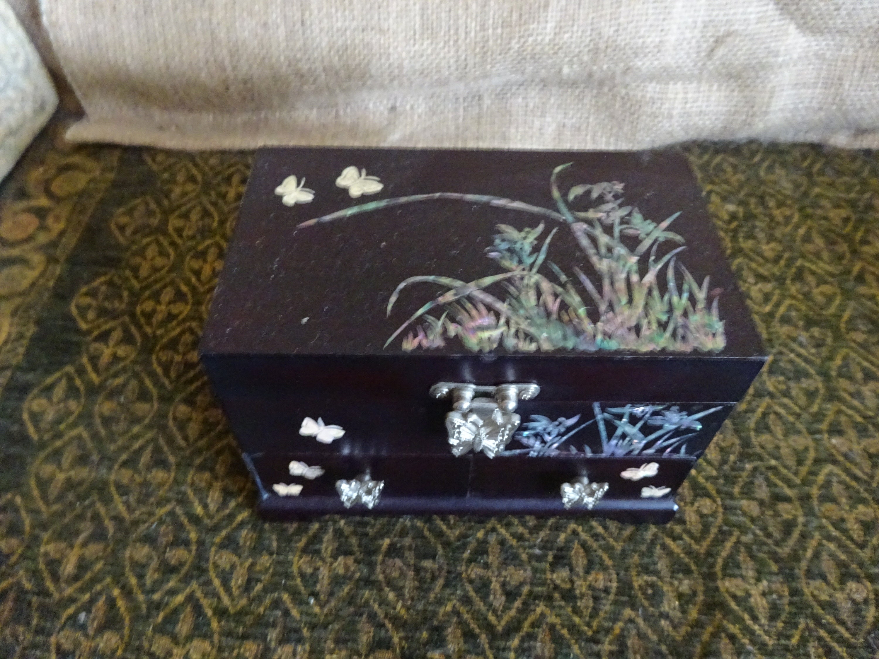 Vintage black lacquer Chinese jewellery box with abalone butterfly floral inlay.