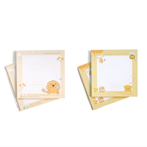 May include: Two packs of sticky notes with cute animal illustrations. One pack features a golden retriever puppy with the text "Stay pawsitive!" and "Don't forget I'm always here for you". The other pack features a honey pot and bee with the text "Wishing you a honey filled day" and "We bee lieve in you".