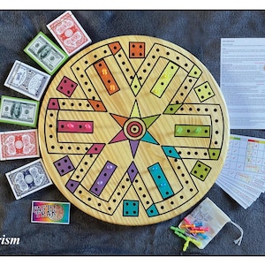 May include: A wooden board game with a circular design, featuring colorful pegs and dice patterns. The game includes play money, playing cards, and instructions. The board has a star-shaped center and is surrounded by various colored sections.