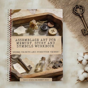 May include: A spiral-bound workbook titled "Assemblage Art for Memory, Story and Symbols Workbook" with the tagline "Found Objects and Forgotten Things." The cover features a wooden tray with vintage items, including keys, buttons, and a small bottle. Decorative keys and cotton sprigs are on the right.