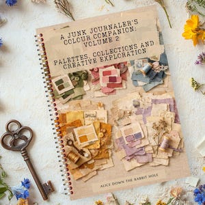 May include: A spiral-bound book titled A Junk Journaler's Colour Companion: Volume 2, Palettes, Collections and Creative Exploration by Alice Down the Rabbit Hole, featuring collages of paper scraps, fabric, buttons, and thread in various colour themes.