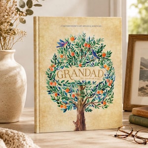 May include: A hardback journal with a beige, textured cover featuring a watercolour illustration of a tree with green leaves, orange fruit, and blue birds. The text reads A GRANDFATHER'S LIFE JOURNAL KEEPSAKE and GRANDAD TELL US YOUR STORY.