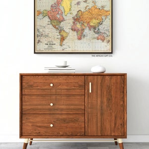 Cavallini World Map colorful Poster in Vintage style in a living room setting.