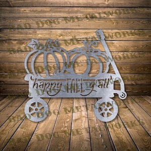Könnte beinhalten: Metall-Ausschnitt eines Wagens, der mit Kürbissen gefüllt ist, und dem Text "happy fall y'all".