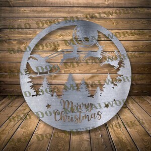 May include: A silver metal Christmas ornament featuring a silhouette of Santa Claus in a sleigh pulled by reindeer flying through a moonlit forest. The ornament reads "Merry Christmas" at the bottom.