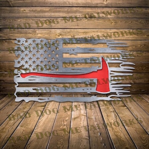 May include: A distressed American flag with a red firefighter axe in the bottom right corner. The flag is made of metal and has a rustic look.
