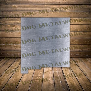 May include: A metal cutout of the state of New Mexico with the words "Bad Dog Metalworks" repeated across the surface.