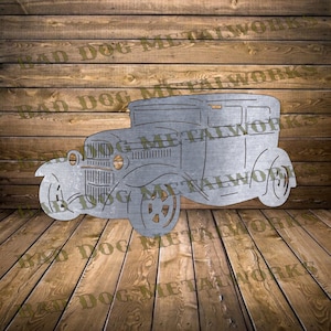 May include: A metal cutout of a vintage car with a rounded roof, a grille, and four wheels. The car is a silhouette, with no interior details.
