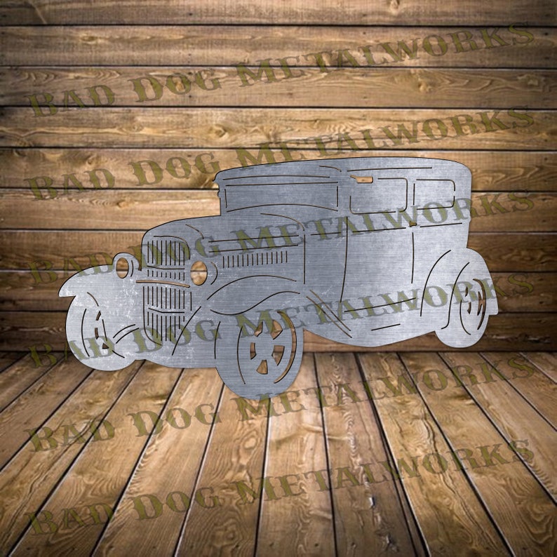 May include: A metal cutout of a vintage car with a rounded roof, a grille, and four wheels. The car is a silhouette, with no interior details.