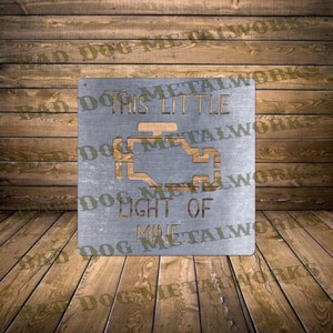 Może przedstawiać: Metalowy znak z wycięciem kontrolki silnika samochodu i tekstem "This Little Light Of Mine".