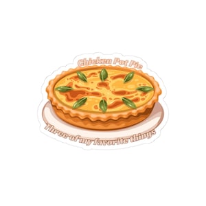 May include: A sticker featuring a chicken pot pie on a white plate. The pie has a golden crust and is topped with green leaves. Text at the top reads "Chicken Pot Pie" and at the bottom "Three of my favorite things."