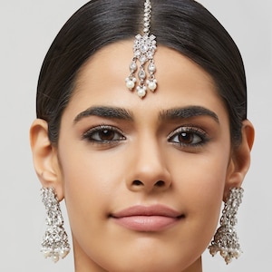 Antique gold jhumka earrings with different color accents, Indian gold earrings and maang tikka, Indian jewelry, Bridesmaids Jewelry.