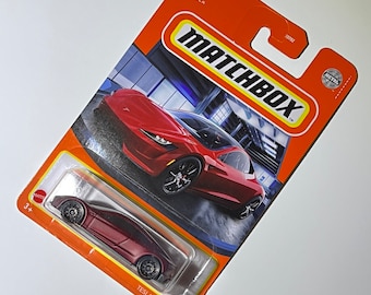 Metallic Satin Red Tesla Roadster Matchbox 1/64th scale.  Matchbox die cast metal car 4/100