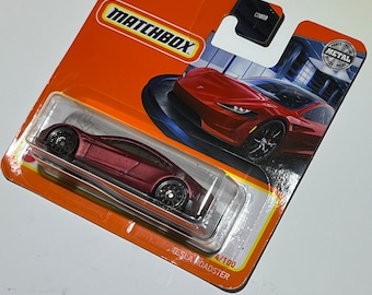 Short card Metallic Satin Red Tesla Roadster Matchbox 1/64th scale.  Matchbox die cast metal car 4/100
