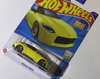 Yellow Nissan Z Proto Hot Wheels 1/64th scale.  Hotwheels die cast metal car, 124/250