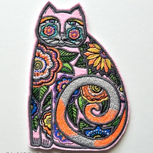 May include: Pink cat-shaped embroidery patch with colorful floral and geometric designs. The patch features a gray outline and a curled tail with orange and gray accents. The text "Colorful Feline Embroidery Patch" and Etsy shop name are at the bottom.